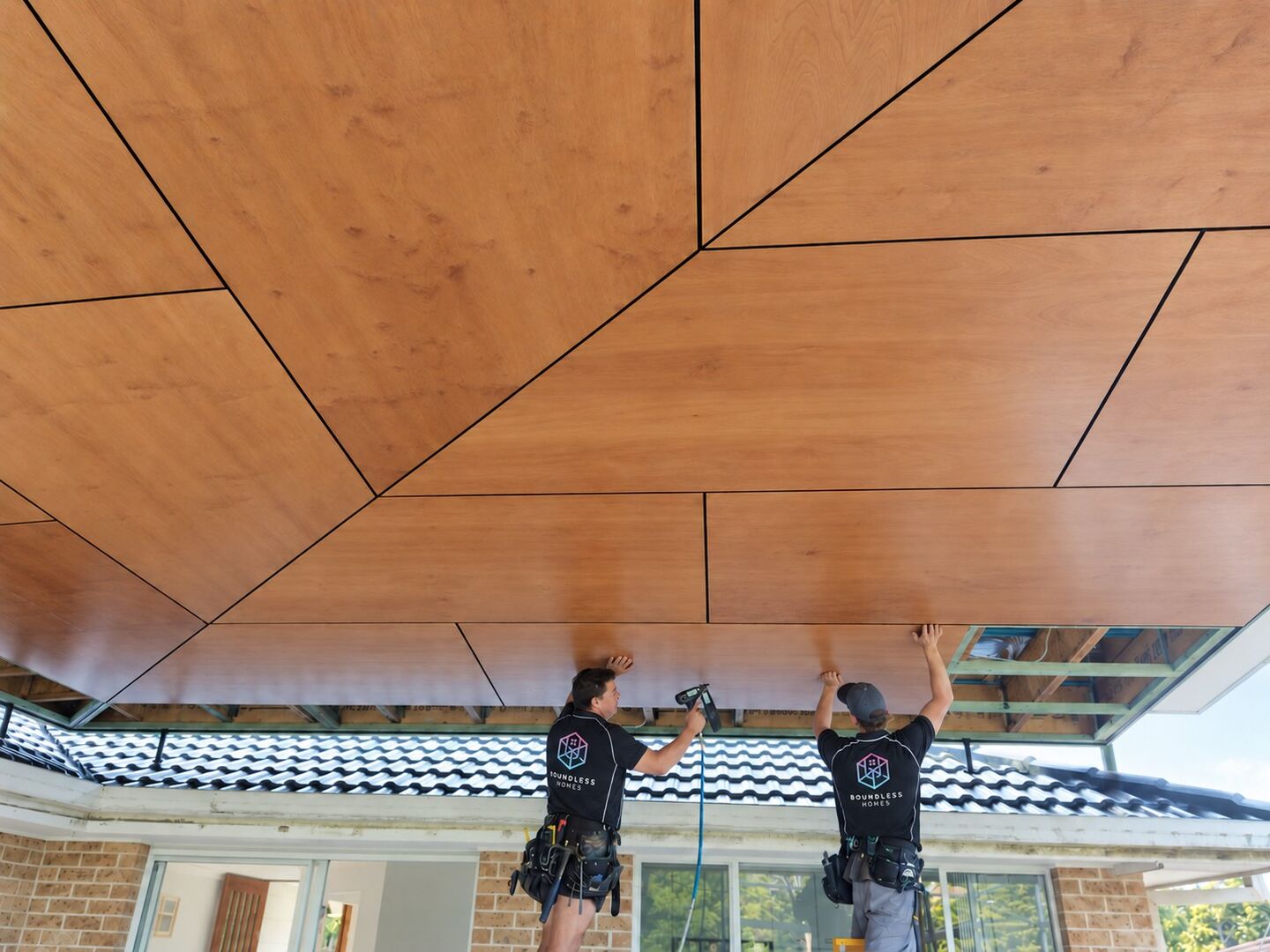 A raked timber-lined soffit ceiling over an alfresco area